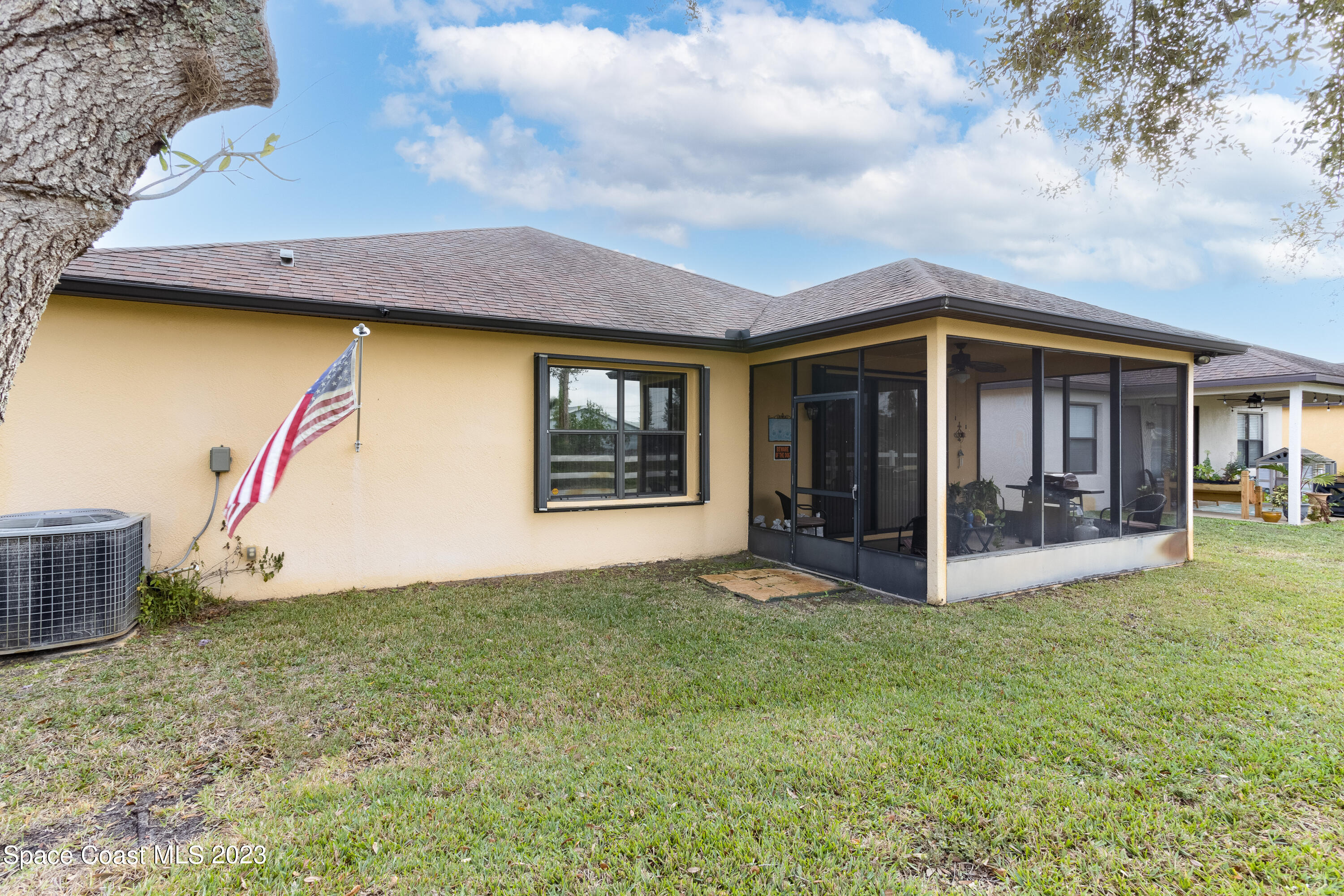 4130 Millicent Circle Melbourne, FL 32901 - Photo 26 of 28 a view of a house with table and chairs