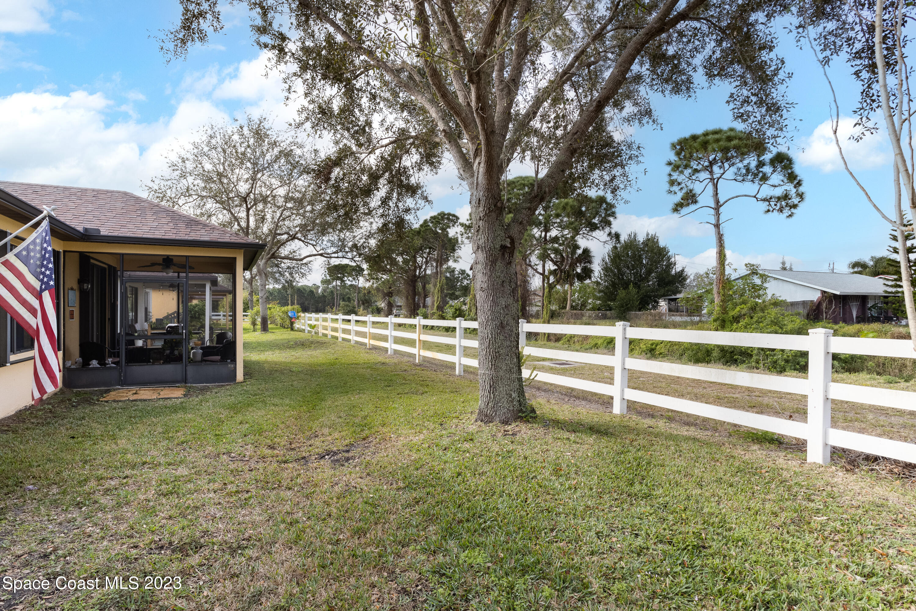 4130 Millicent Circle Melbourne, FL 32901 - Photo 28 of 28 a view of a house with backyard and sitting area