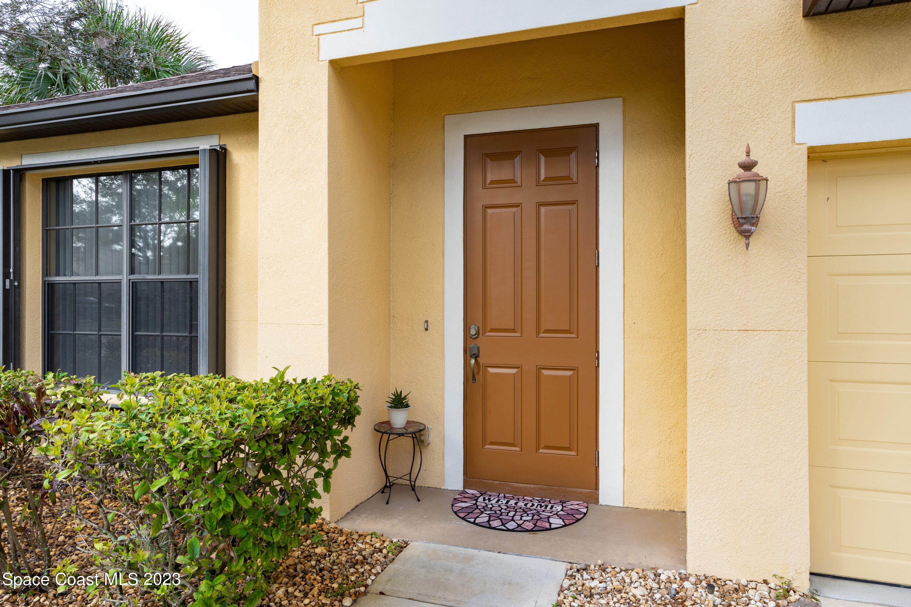 4130 Millicent Circle Melbourne, FL 32901 - Photo 3 of 28 a view of a door and a outdoor space