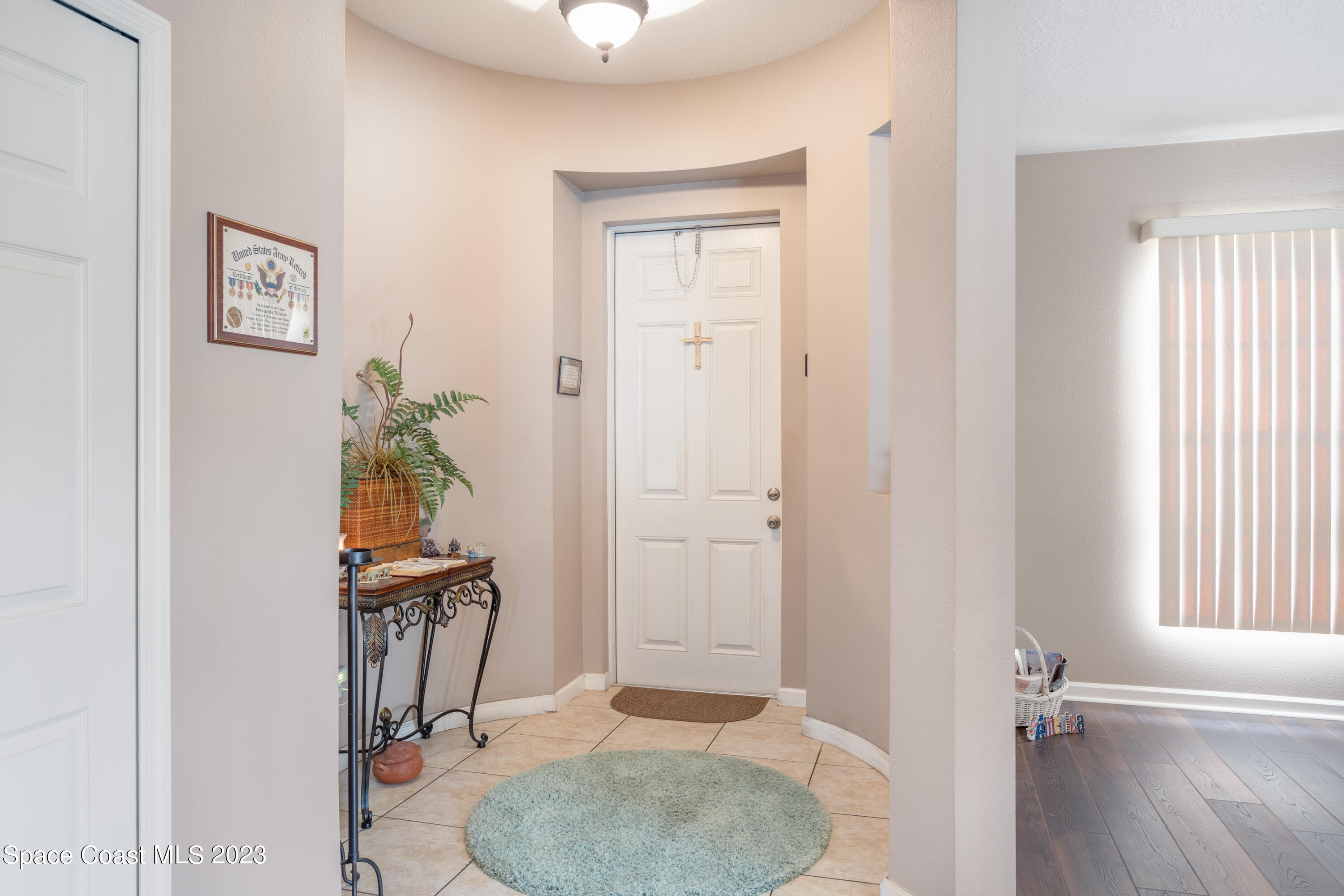4130 Millicent Circle Melbourne, FL 32901 - Photo 4 of 28 a bathroom with a sink a toilet and a mirror