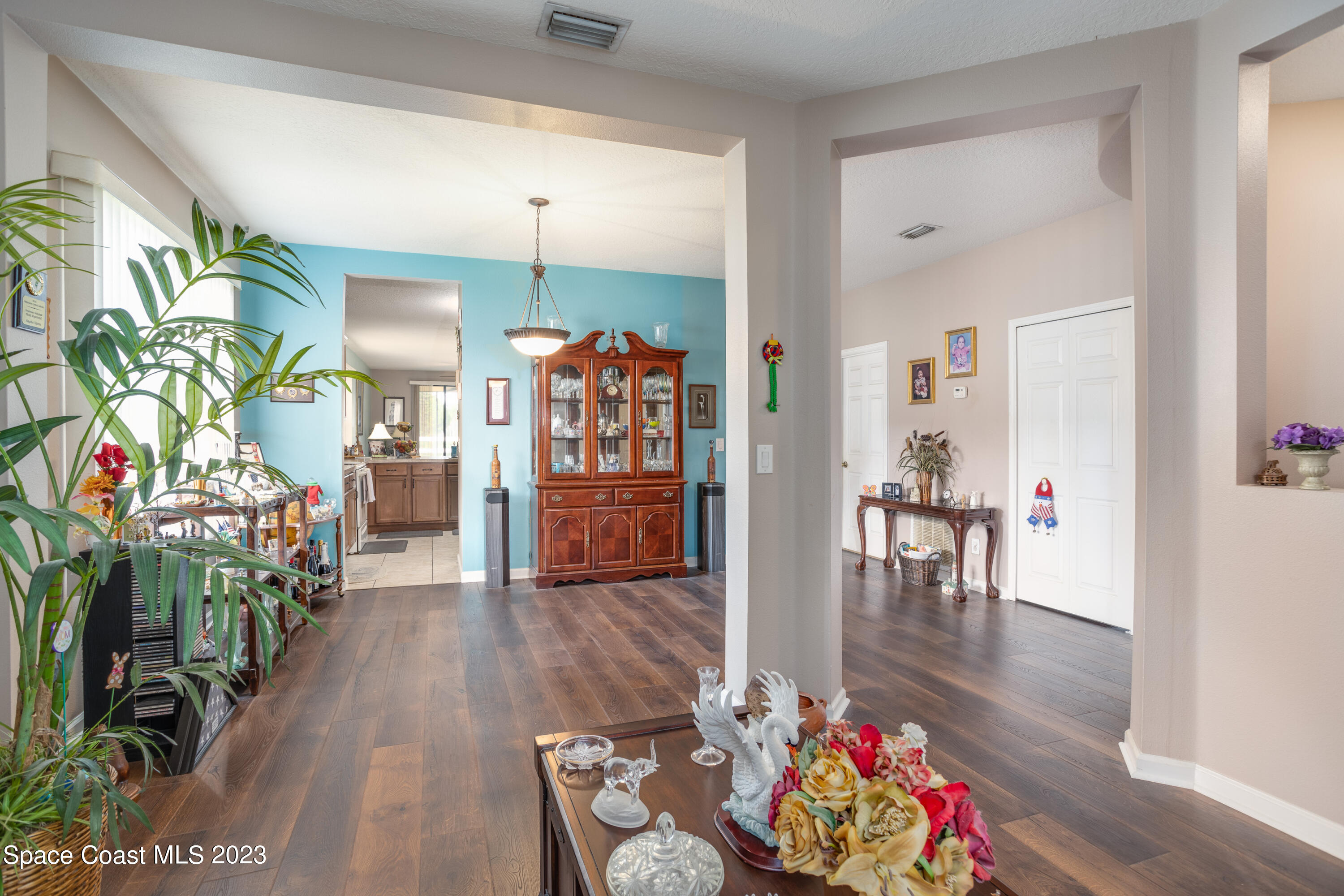 4130 Millicent Circle Melbourne, FL 32901 - Photo 7 of 28 a living room with furniture and a wooden floor