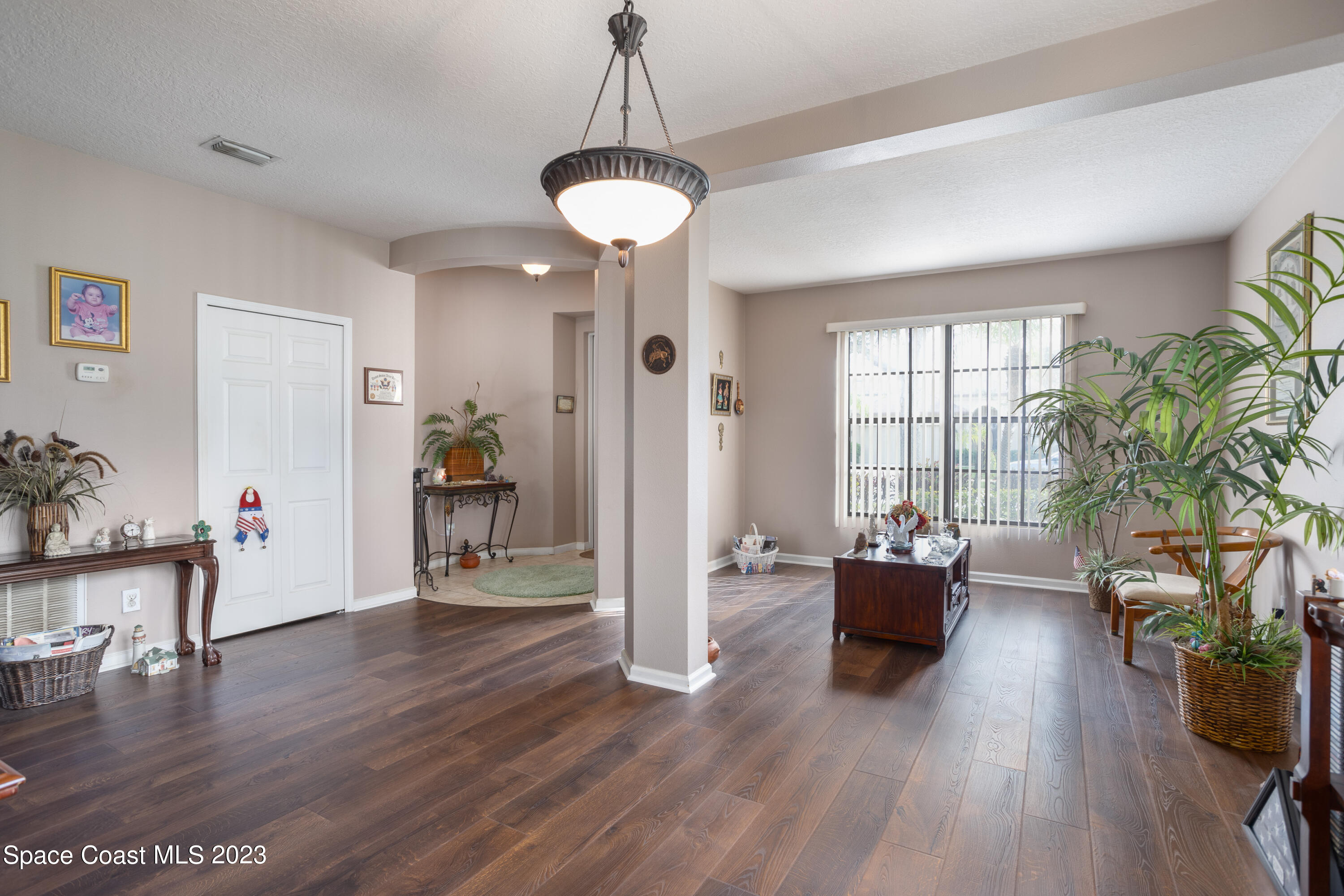 4130 Millicent Circle Melbourne, FL 32901 - Photo 8 of 28 a living room with furniture and a potted plant