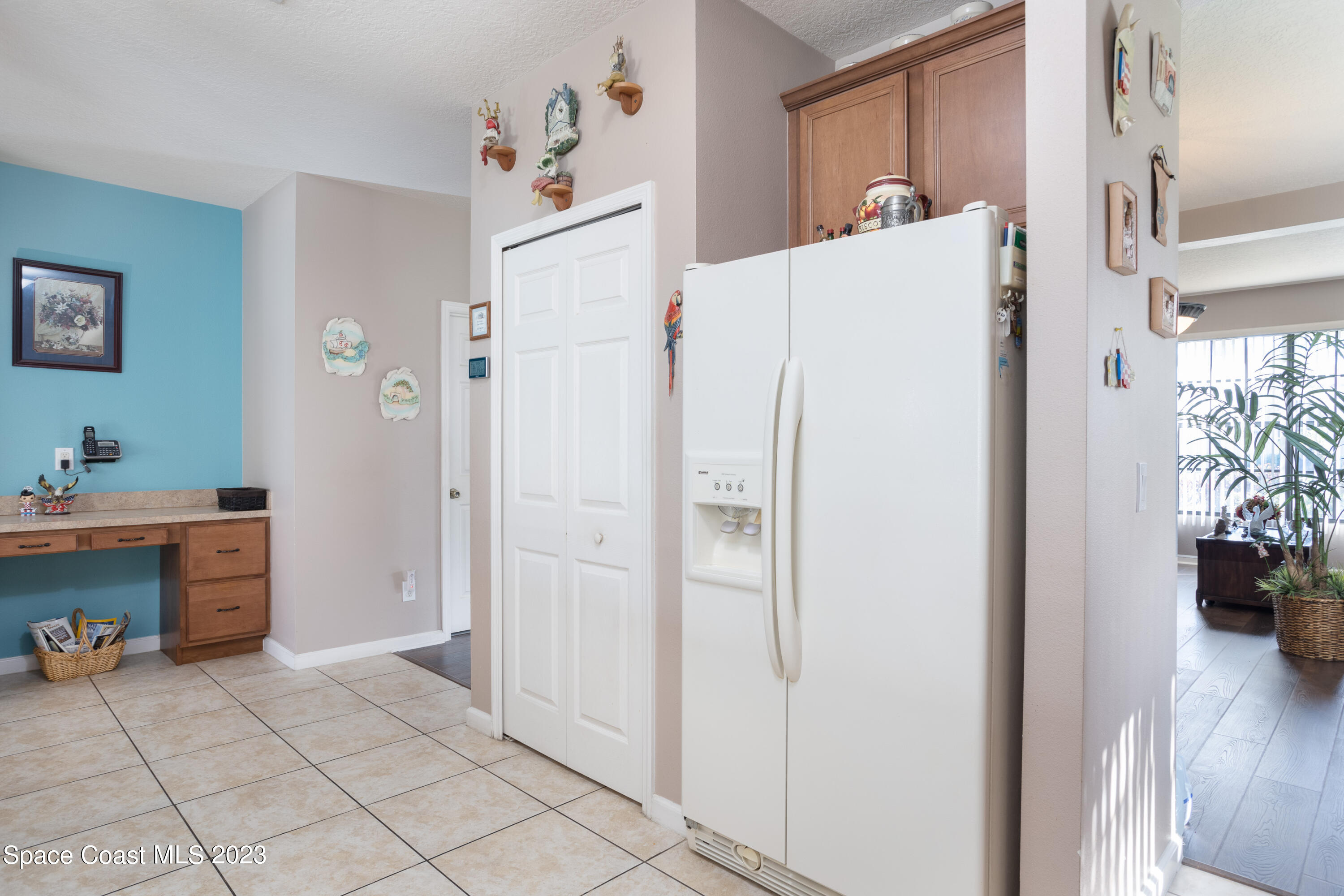 4130 Millicent Circle Melbourne, FL 32901 - Photo 10 of 28 a white refrigerator freezer sitting in a kitchen