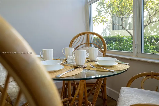 a view of a dining room with furniture window and outside view