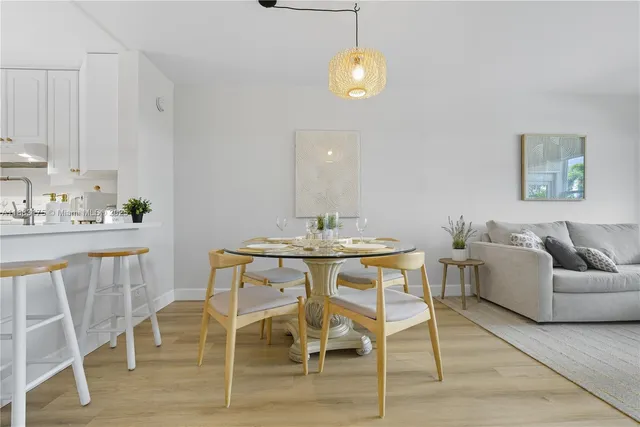 a bathroom with a sink toilet and a mirror