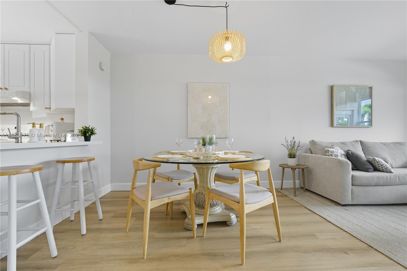 1501 South Ocean Boulevard, Unit 117 Lauderdale-by-the-Sea, FL 33062 - Photo 18 of 38 a view of a dining room with furniture and wooden floor
