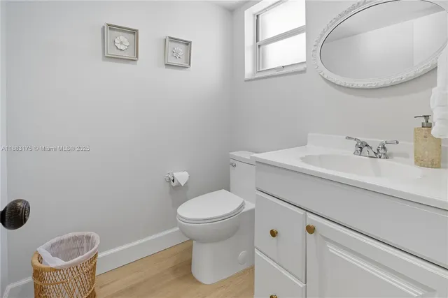 a bedroom with a bed a couch and a window