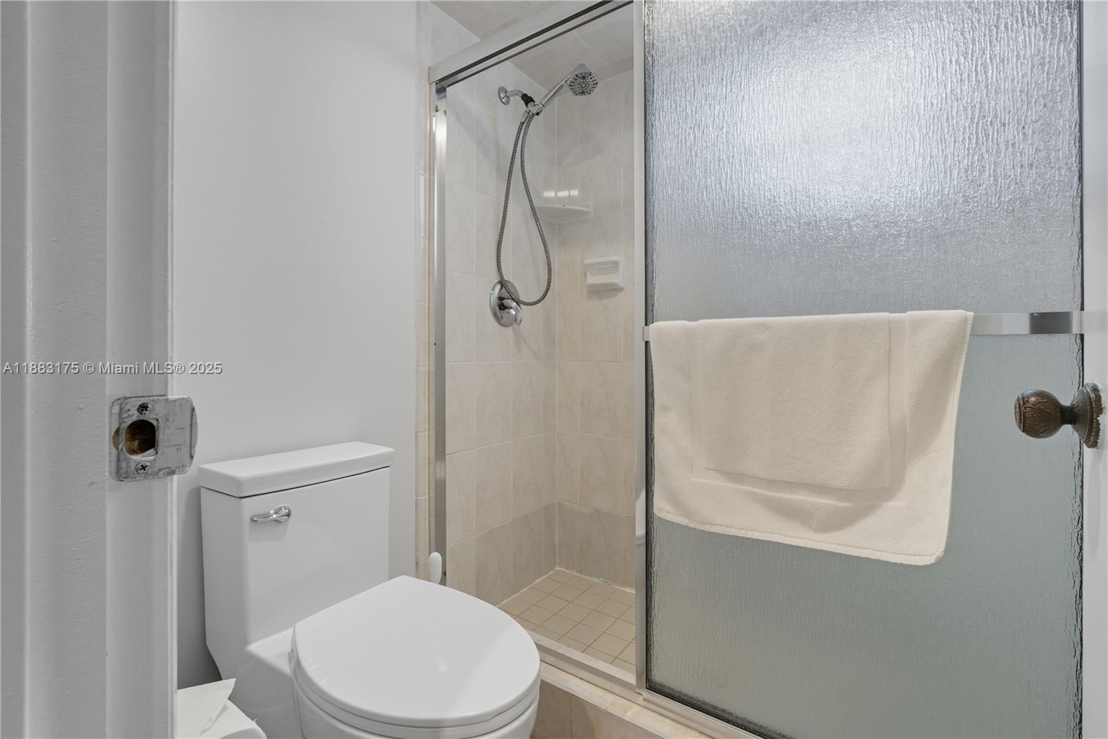 1501 South Ocean Boulevard, Unit 117 Lauderdale-by-the-Sea, FL 33062 - Photo 26 of 38 a bathroom with a toilet and shower