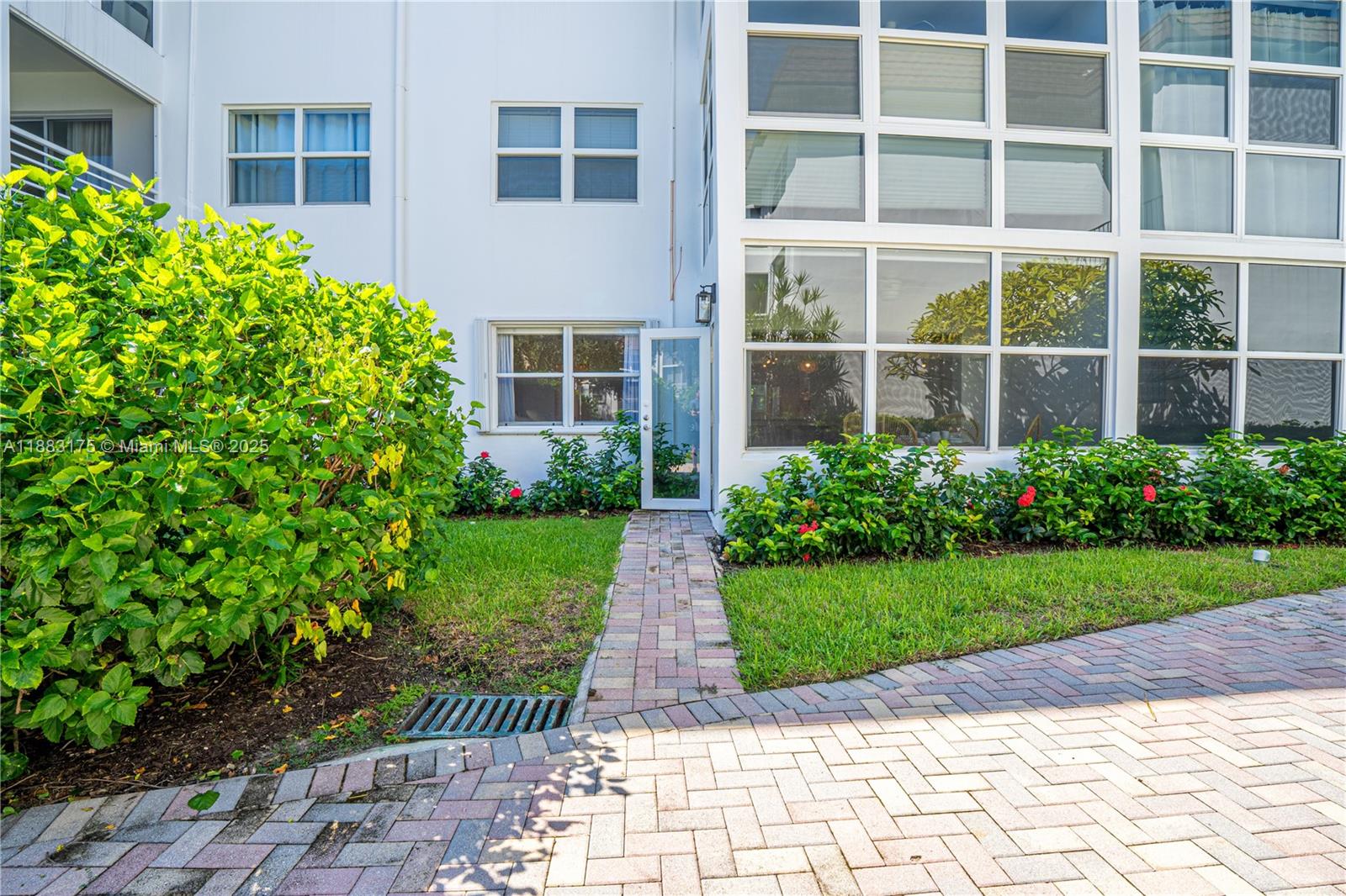 1501 South Ocean Boulevard, Unit 117 Lauderdale-by-the-Sea, FL 33062 - Photo 27 of 38 a view of a garden with pathway
