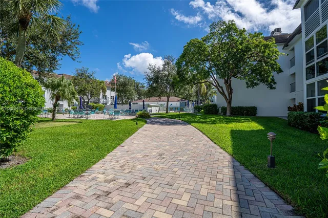 a view of a patio with a yard