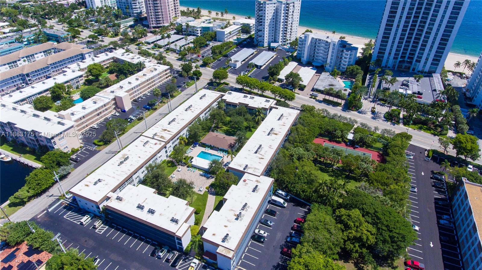 1501 South Ocean Boulevard, Unit 117 Lauderdale-by-the-Sea, FL 33062 - Photo 4 of 38 an aerial view of residential houses with outdoor space