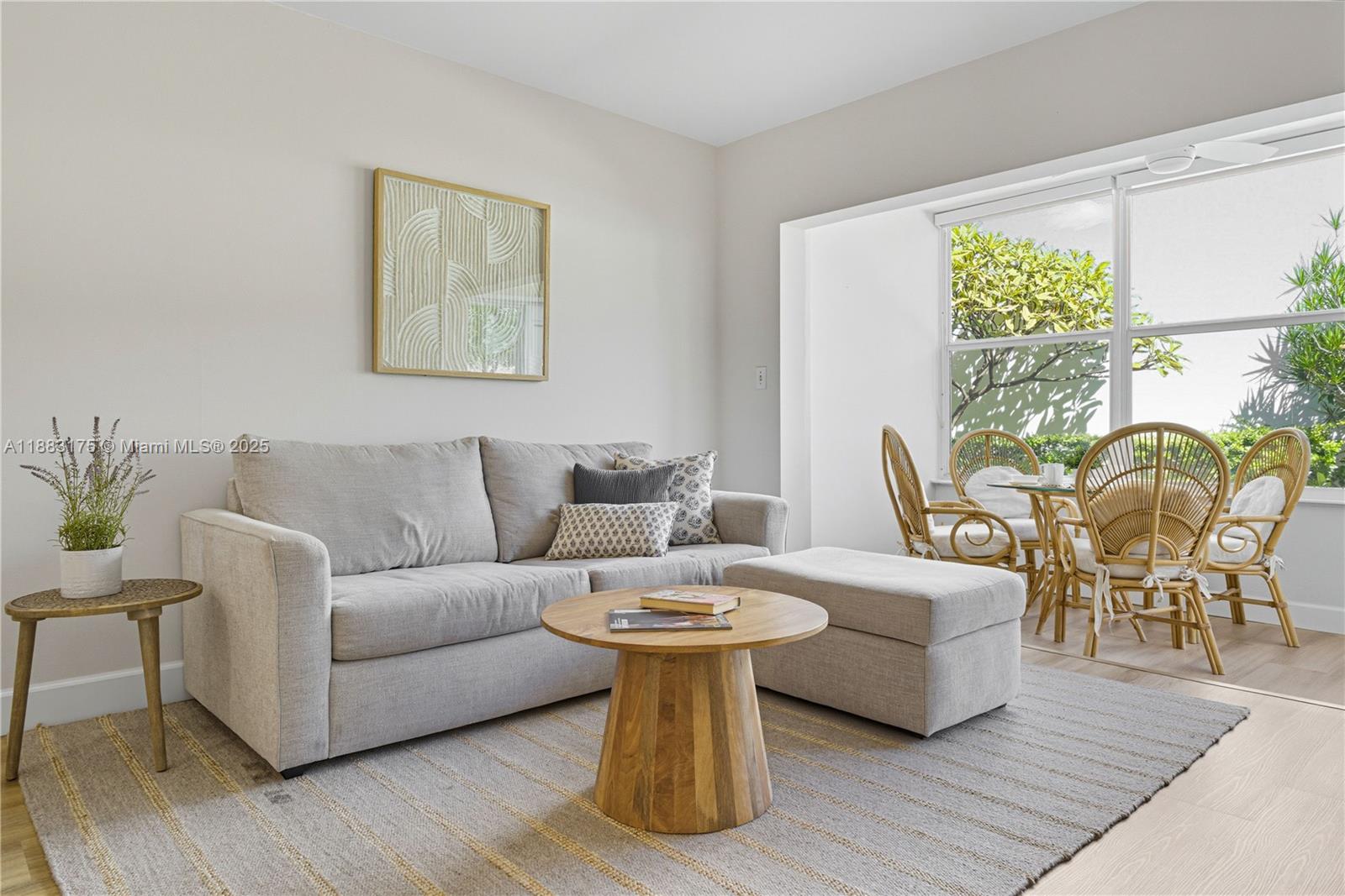 1501 South Ocean Boulevard, Unit 117 Lauderdale-by-the-Sea, FL 33062 - Photo 6 of 38 a living room with fireplace furniture and a wooden floor
