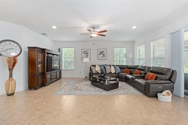 a living room with furniture or kitchen view and a dining table
