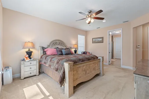 a bathroom with a granite countertop double vanity sink mirror bathtub and shower
