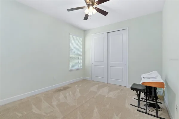 a view of a patio with a dining table and chairs