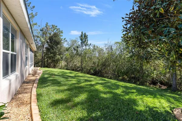 an aerial view of a house with a swimming pool yard and outdoor seating