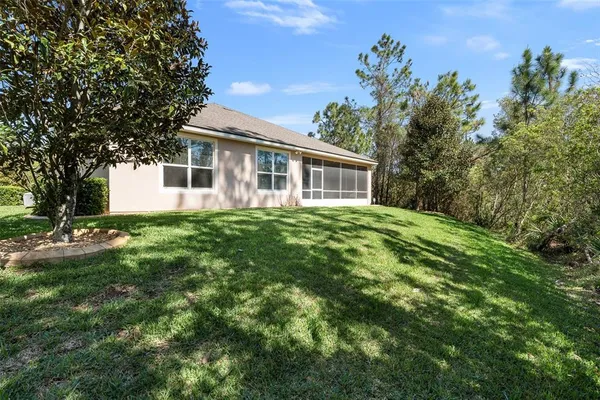 an aerial view of residential houses with outdoor space and swimming pool