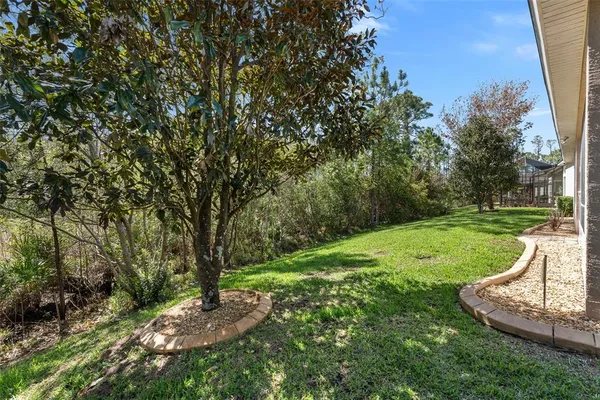 an aerial view of residential houses with outdoor space and lake view