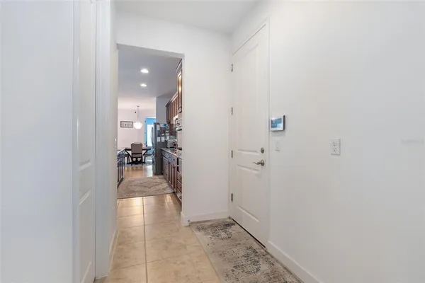 a open kitchen with stainless steel appliances granite countertop a stove top oven a sink dishwasher and a stove with wooden floor