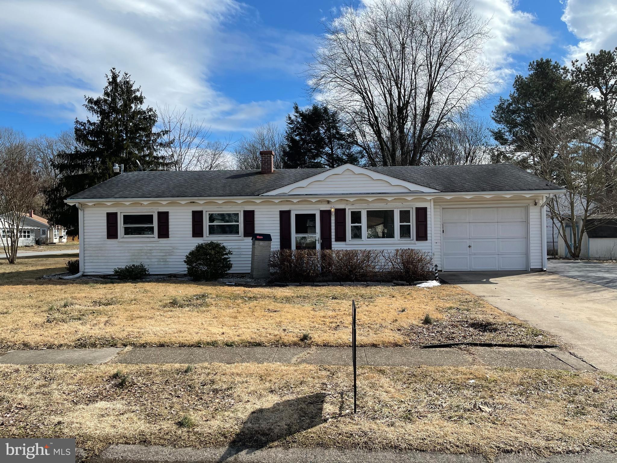 135 Garrett Road Newark, DE 19713 - Photo 1 of 32 a front view of a house with a yard covered in snow