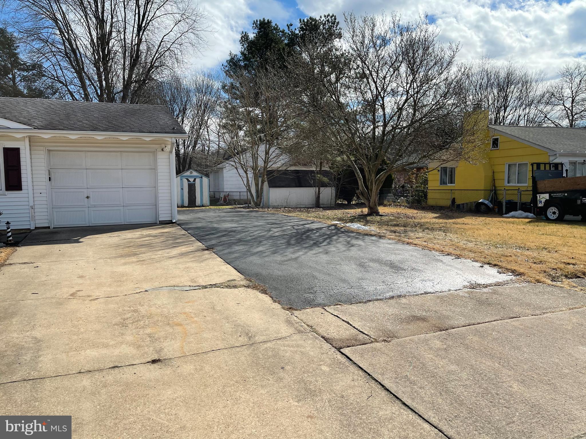 135 Garrett Road Newark, DE 19713 - Photo 2 of 32 a front view of a house with a yard and garage