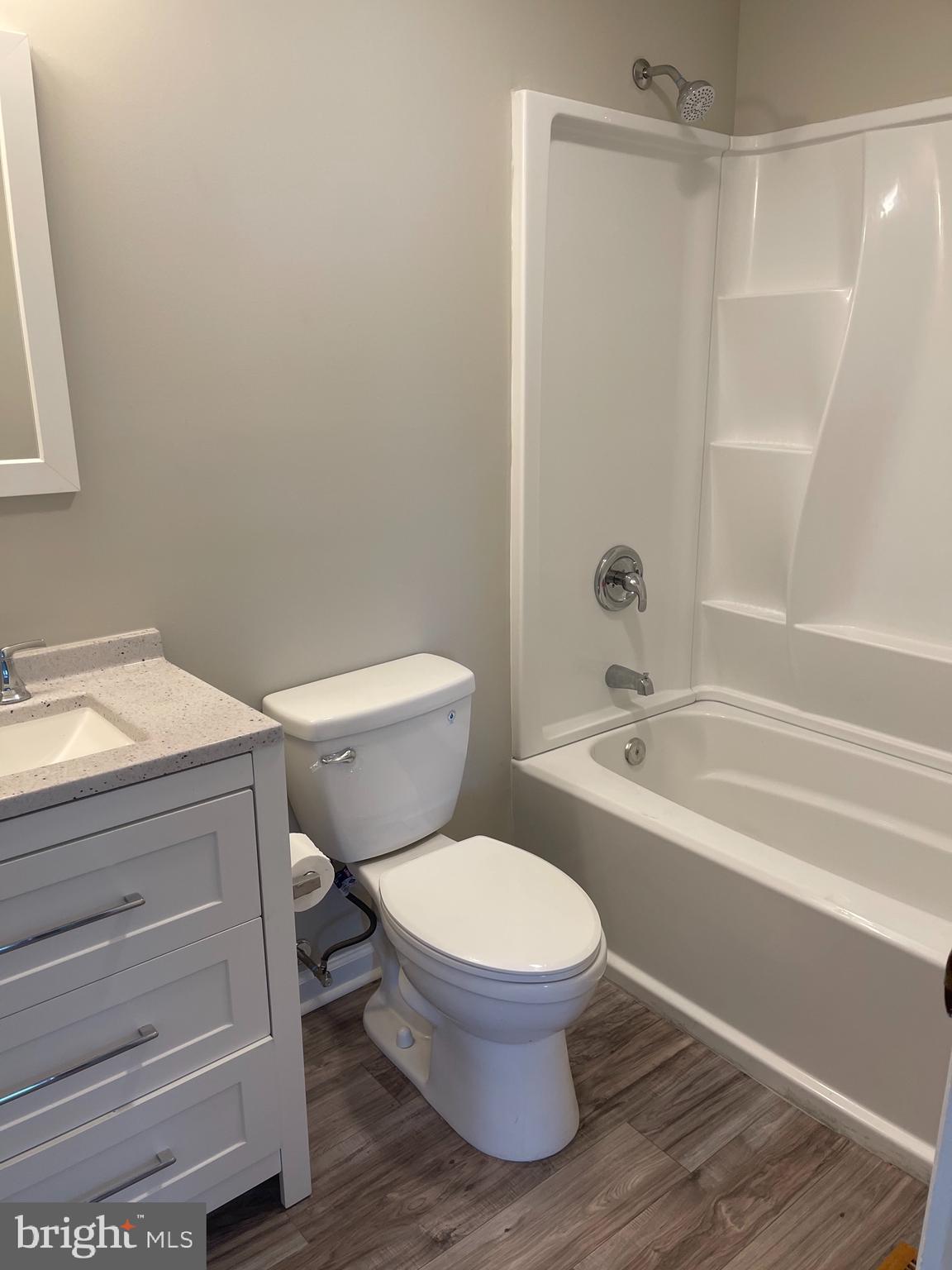 135 Garrett Road Newark, DE 19713 - Photo 16 of 32 a white toilet sitting next to a bath tub