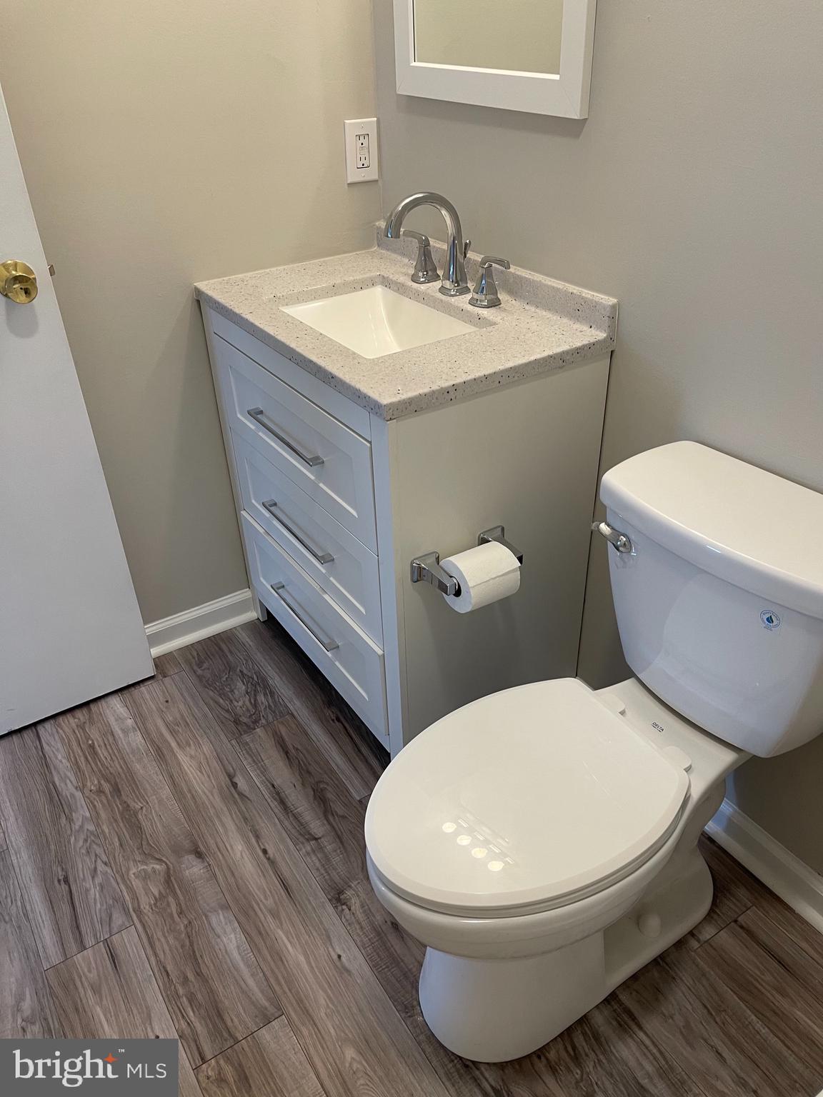 135 Garrett Road Newark, DE 19713 - Photo 17 of 32 a white toilet sitting next to a bathroom sink