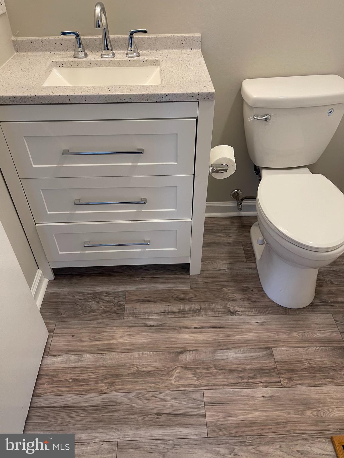135 Garrett Road Newark, DE 19713 - Photo 18 of 32 a bathroom with a toilet and a sink
