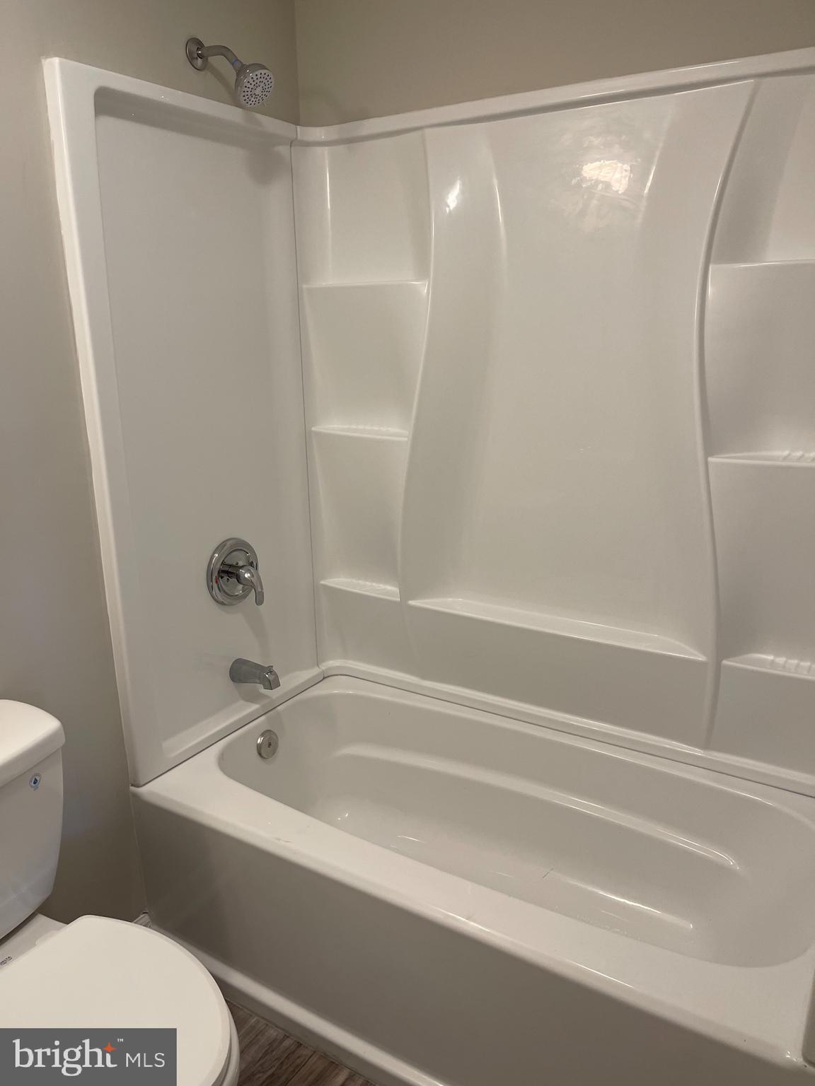 135 Garrett Road Newark, DE 19713 - Photo 21 of 32 a bathroom with a shower and a toilet