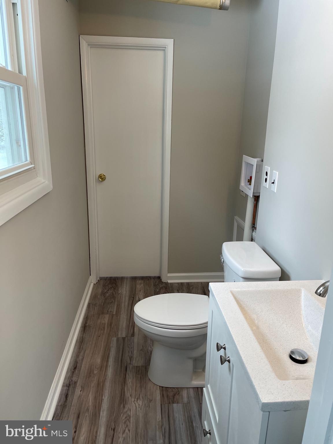 135 Garrett Road Newark, DE 19713 - Photo 28 of 32 a bathroom with a sink and a toilet