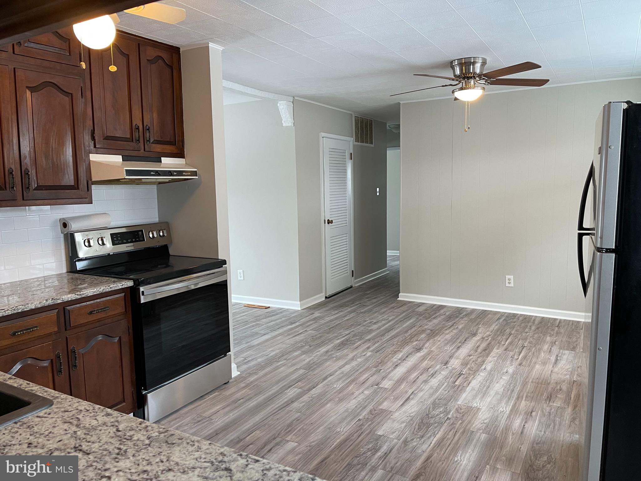 135 Garrett Road Newark, DE 19713 - Photo 9 of 32 a view of kitchen with wooden floor and electronic appliances