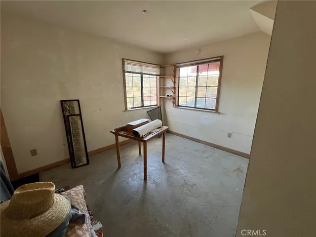 a bedroom with furniture and window