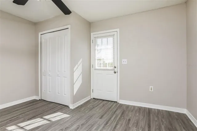 an empty room with wooden floor