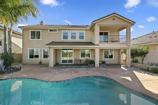 a front view of a house with a yard table and chairs