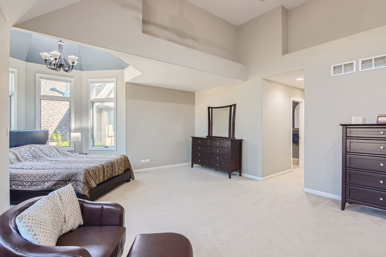 1419 Rue Paris Place Inverness, IL 60067 - Photo 15 of 28 a bed room with furniture and a chandelier