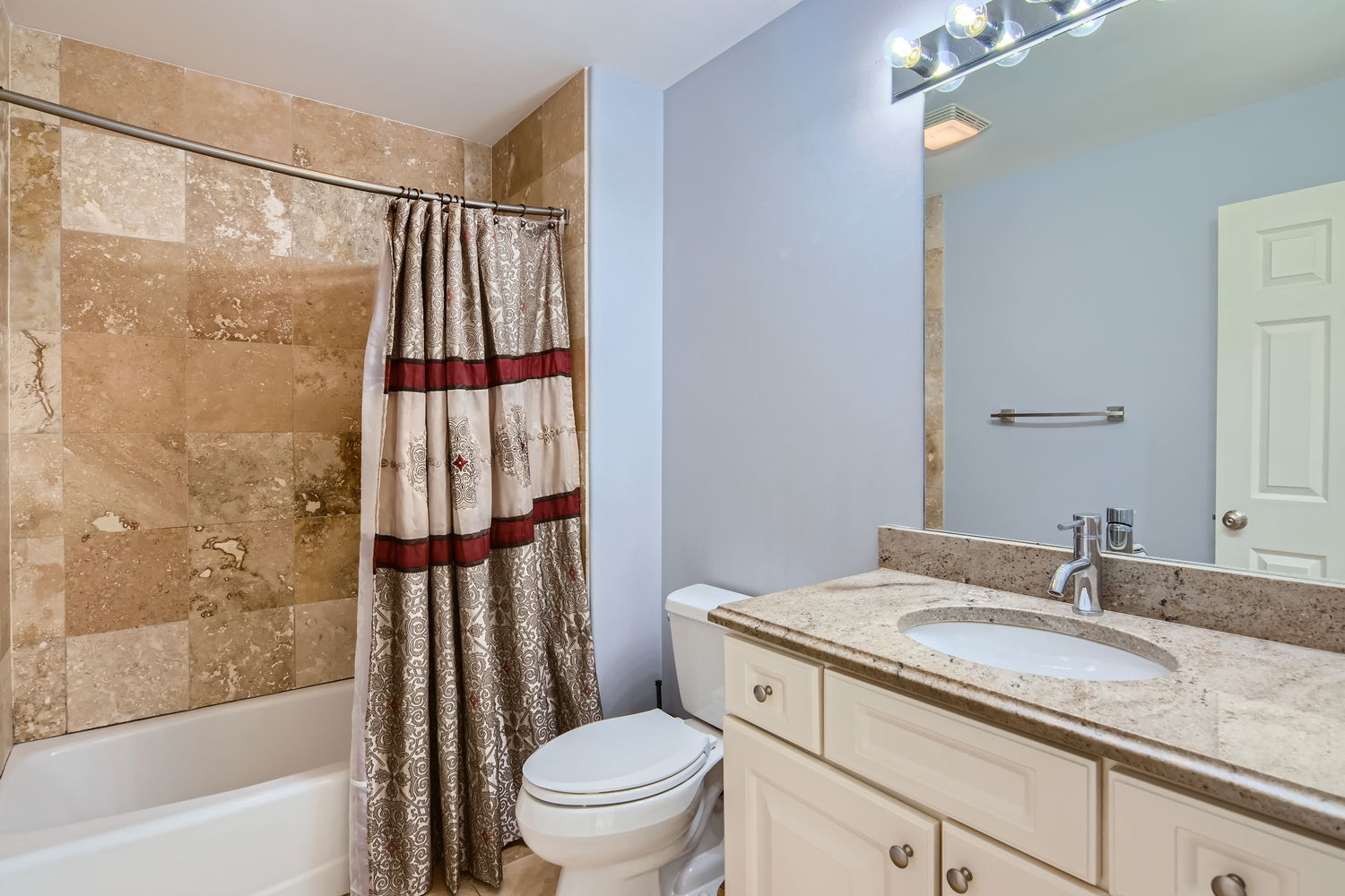1419 Rue Paris Place Inverness, IL 60067 - Photo 22 of 28 a bathroom with a granite countertop sink toilet and shower