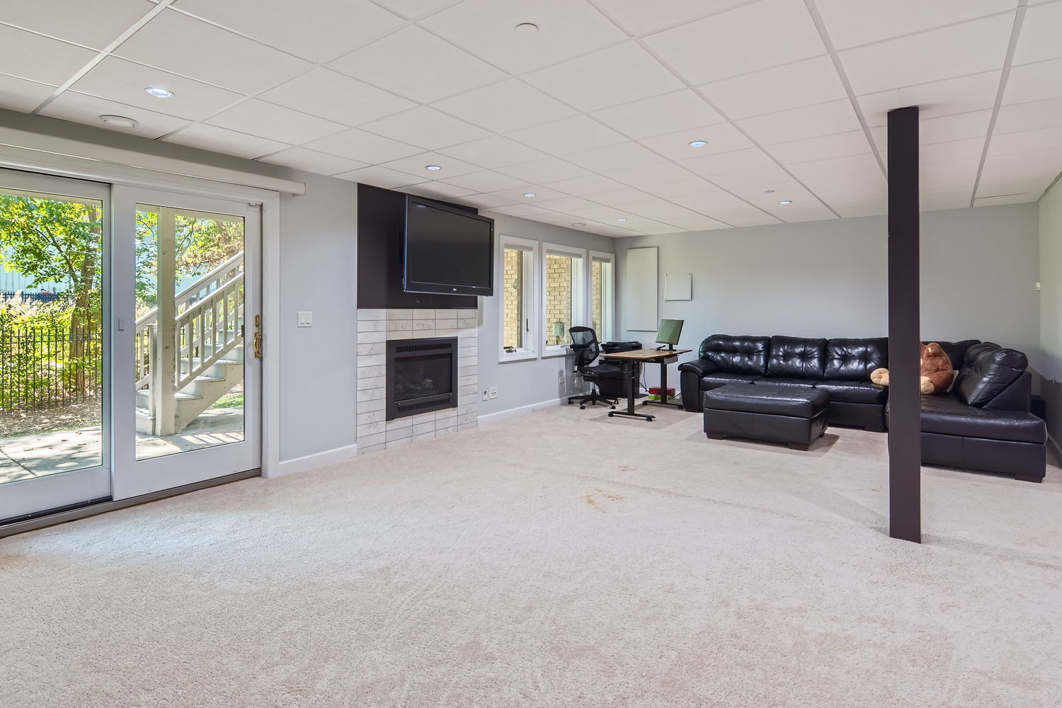 1419 Rue Paris Place Inverness, IL 60067 - Photo 23 of 28 a living room with furniture flat screen tv and a fireplace