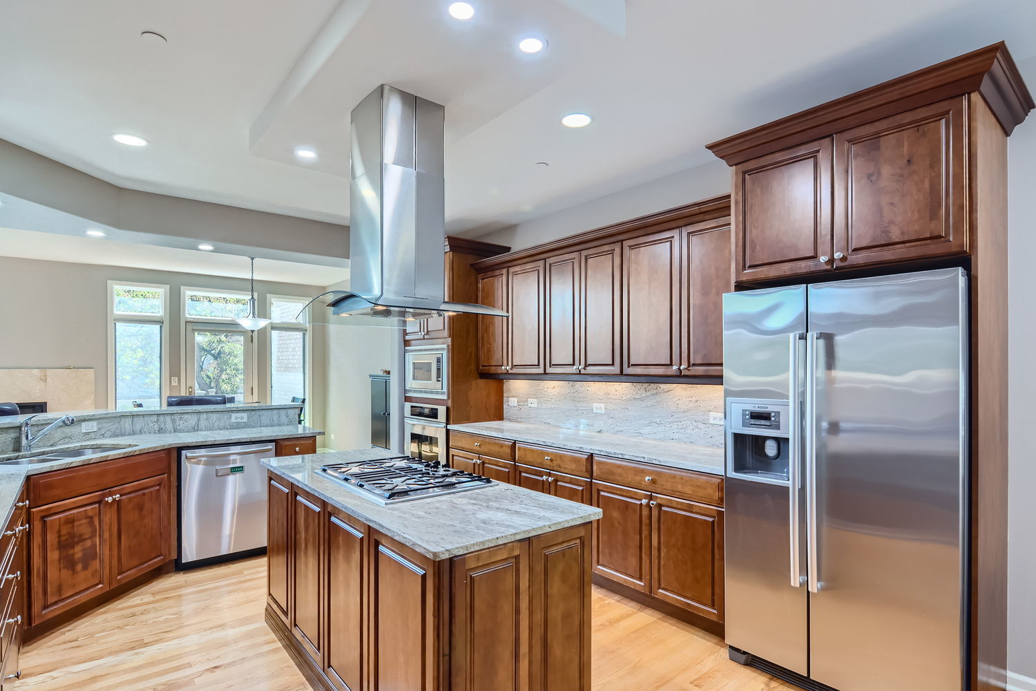 1419 Rue Paris Place Inverness, IL 60067 - Photo 8 of 28 a kitchen with kitchen island granite countertop a stove refrigerator and cabinets