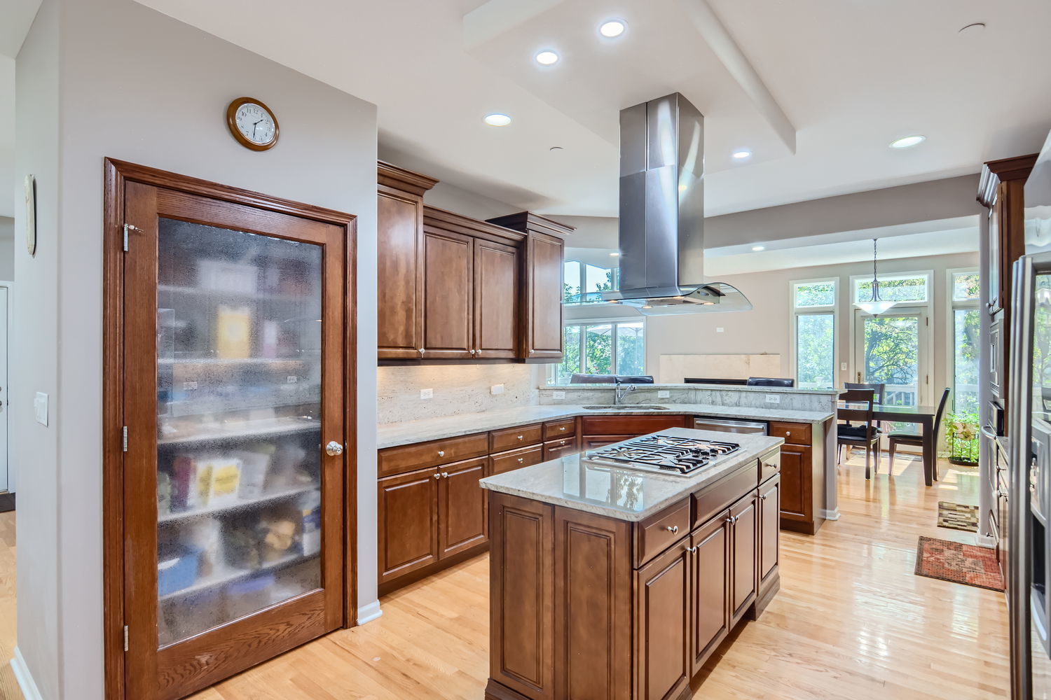 1419 Rue Paris Place Inverness, IL 60067 - Photo 9 of 28 a kitchen with stainless steel appliances granite countertop a stove top oven a sink and a refrigerator