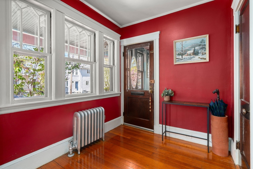 45 Springfield Street, Unit 1 Belmont, MA 02478 - Photo 3 of 27 a view of a livingroom with furniture and windows