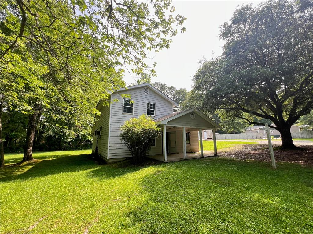 340 Womack Avenue Dallas, GA 30157 - Photo 22 of 29 a front view of a house with a garden