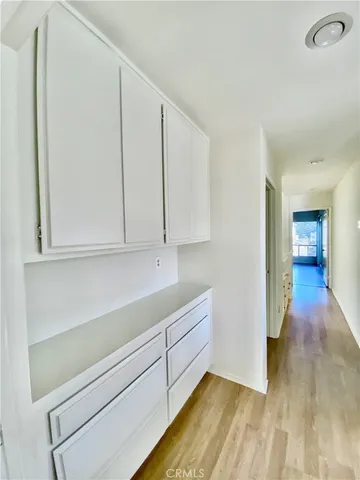 a view of storage and utility room with closet