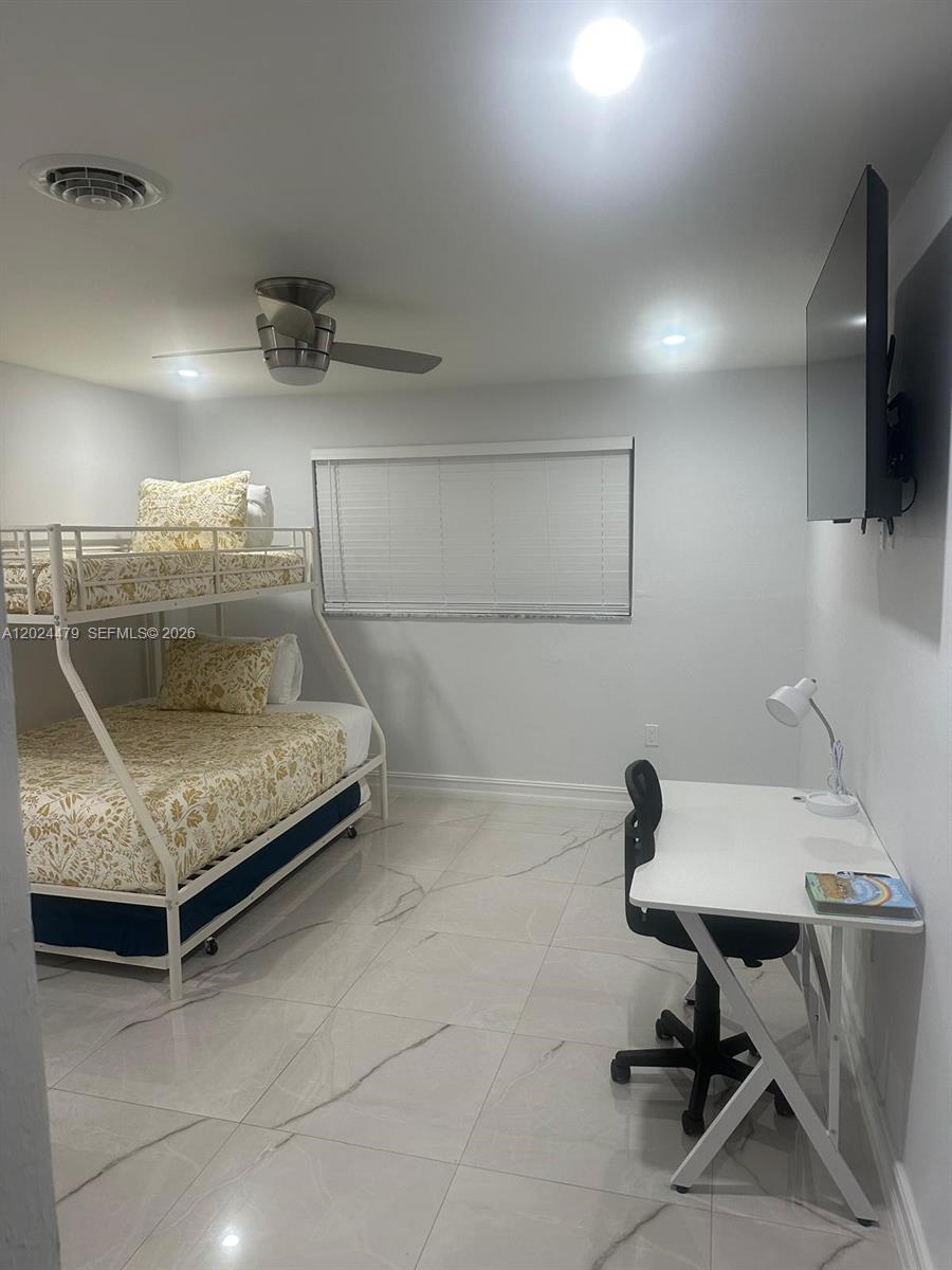2212 Club House Road North Fort Myers, FL 33917 - Photo 21 of 40 a bedroom with a bed and a chair