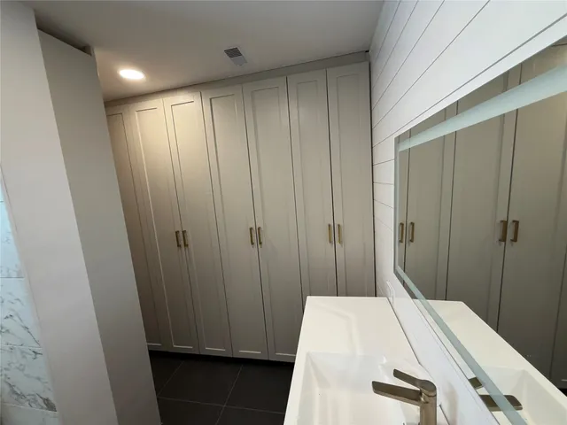 a bathroom with a shower and toilet