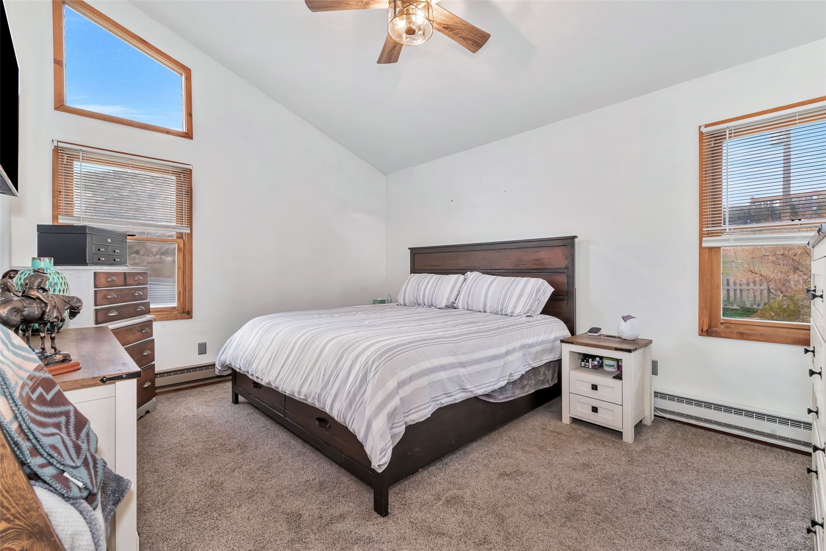 224 C R 206 Craig, CO 81625 - Photo 13 of 50 a bedroom with a bed and a chandelier