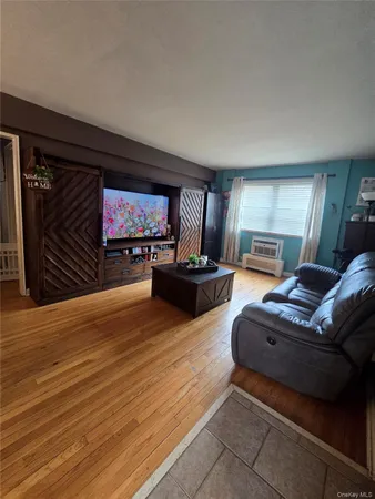 a living room with furniture flat screen tv and a fireplace