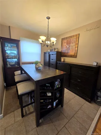 a dining room with a table and chairs
