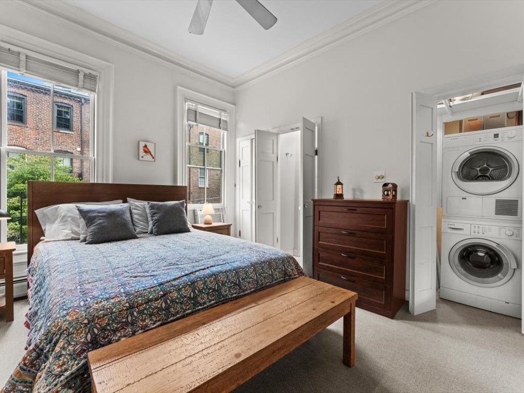 103 Appleton Street, Unit 3 Boston, MA 02116 - Photo 14 of 24 a bedroom with a bed and a washing machine
