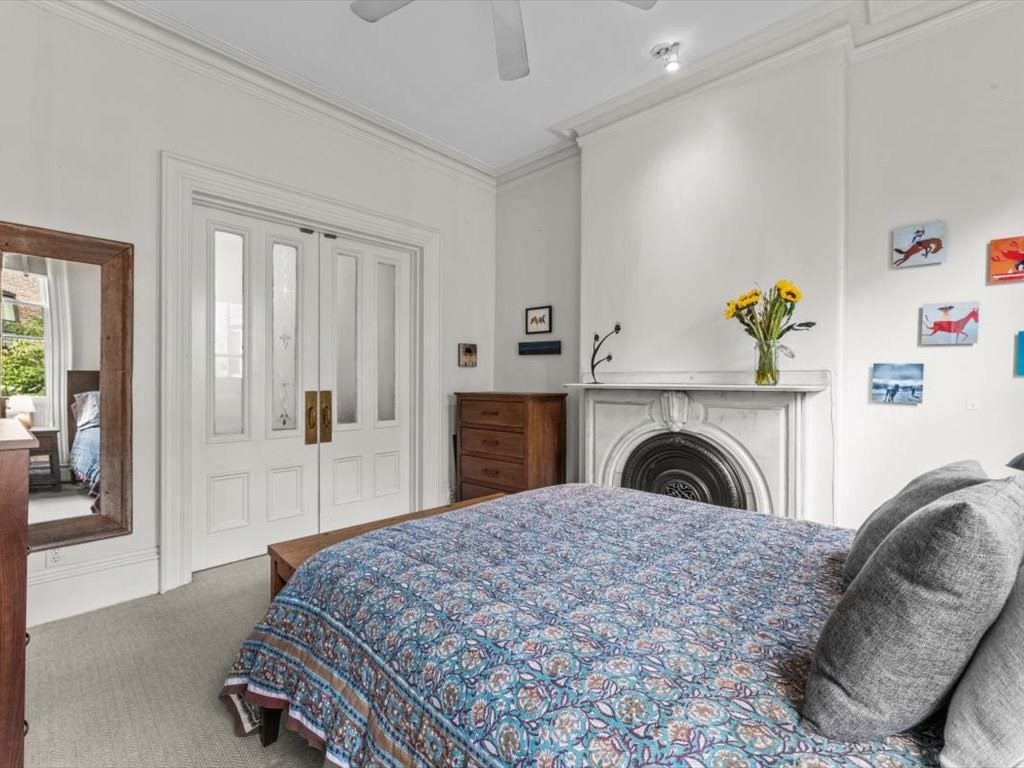 103 Appleton Street, Unit 3 Boston, MA 02116 - Photo 16 of 24 a living room with a couch and a table with wooden floor