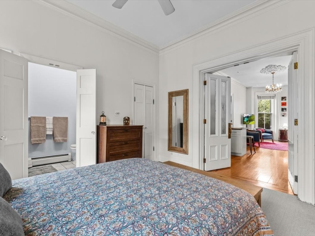 103 Appleton Street, Unit 3 Boston, MA 02116 - Photo 17 of 24 a bedroom with a bed and wooden floor